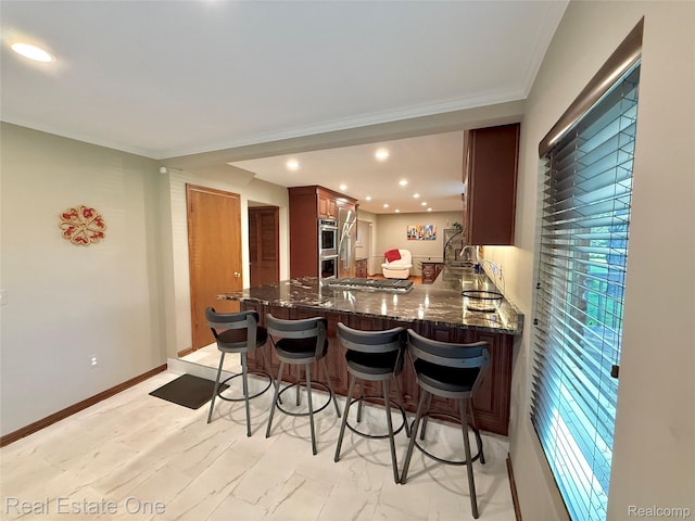 2546 Limerick Ln, Troy, MI 48098 - kitchen with a kitchen breakfast bar, stainless steel appliances, a peninsula, dark stone counters, and recessed lighting