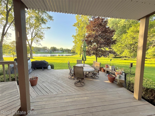 2546 Limerick Ln, Troy, MI 48098 - wooden deck featuring a water view, outdoor dining area, a yard, and view of wooded area