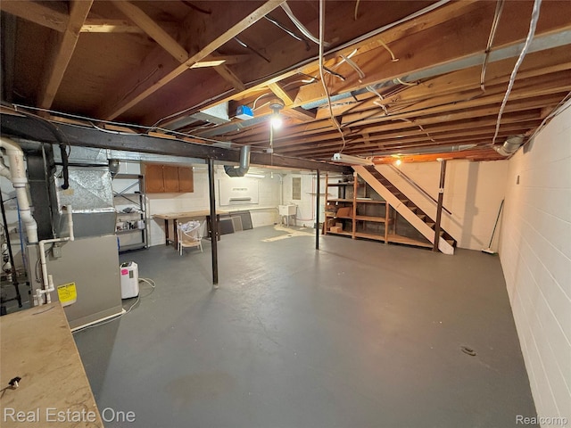 2546 Limerick Ln, Troy, MI 48098 - unfinished below grade area featuring stairway and heating unit