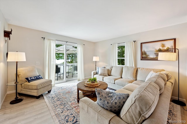 6201 Academy Dr, Brighton, MI 48116 - living room featuring light wood-style flooring and baseboards