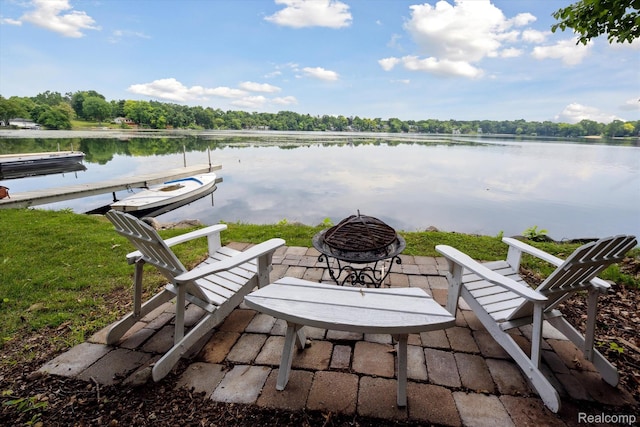 6201 Academy Dr, Brighton, MI 48116 - view of patio / terrace with an outdoor fire pit and a water view