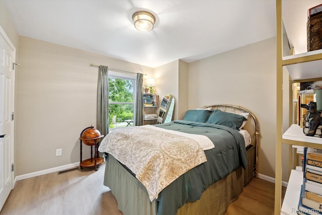 6201 Academy Dr, Brighton, MI 48116 - bedroom featuring light wood-type flooring
