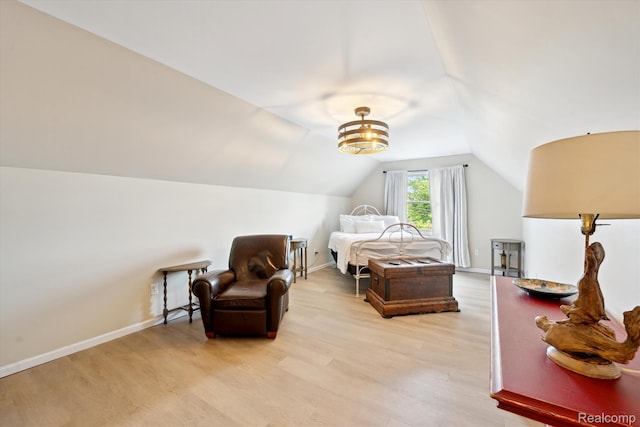 6201 Academy Dr, Brighton, MI 48116 - bedroom with light wood-type flooring and lofted ceiling