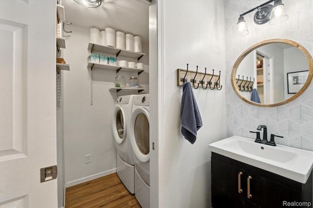 6201 Academy Dr, Brighton, MI 48116 - washroom with washing machine and clothes dryer and wood finished floors