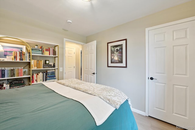 6201 Academy Dr, Brighton, MI 48116 - bedroom with wood finished floors and baseboards