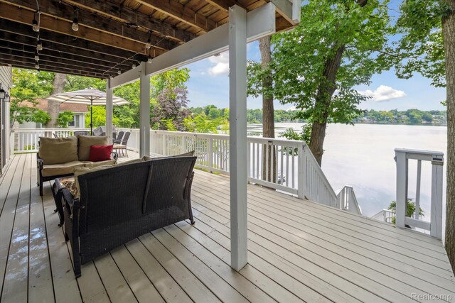 6201 Academy Dr, Brighton, MI 48116 - wooden terrace with outdoor lounge area and a water view