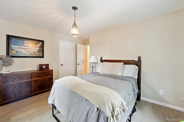 6201 Academy Dr, Brighton, MI 48116 - bedroom with light wood finished floors and baseboards