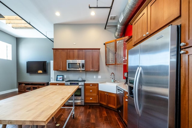 403 State St Unit 6, Saint Joseph, MI 49085 - kitchen featuring appliances with stainless steel finishes, brown cabinets, dark wood-style flooring, and recessed lighting