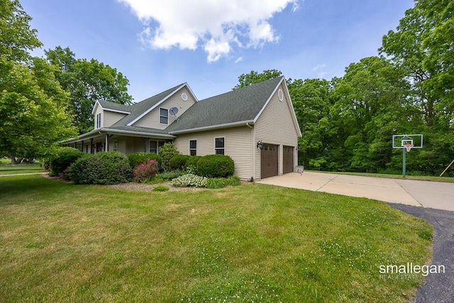 3192 W Sisson Rd, Freeport, MI 49325 - view of front facade with a front lawn, concrete driveway, and roof with shingles