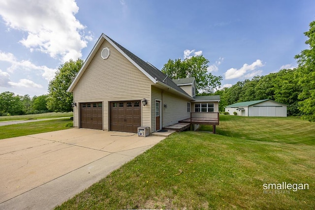 3192 W Sisson Rd, Freeport, MI 49325 - view of side of home with a lawn, driveway, a garage, and a deck