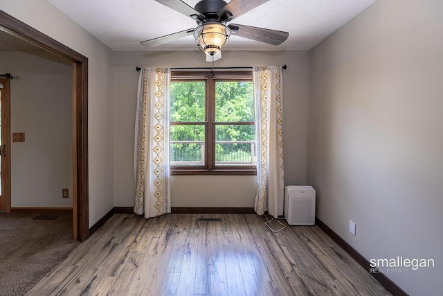 3192 W Sisson Rd, Freeport, MI 49325 - spare room with wood finished floors and a ceiling fan