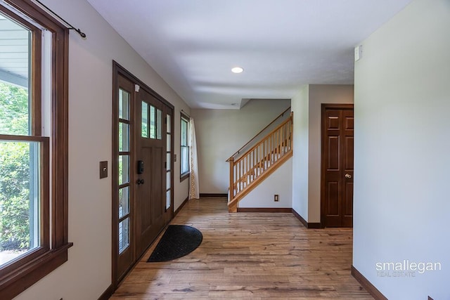 3192 W Sisson Rd, Freeport, MI 49325 - foyer entrance featuring wood finished floors, stairway, and recessed lighting