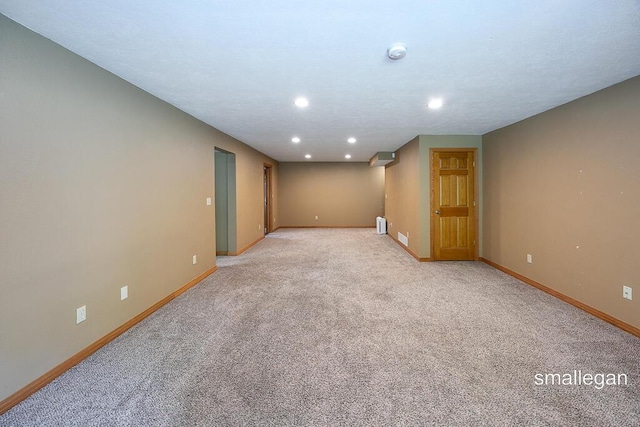 3192 W Sisson Rd, Freeport, MI 49325 - spare room with light carpet, a smoke detector, and recessed lighting