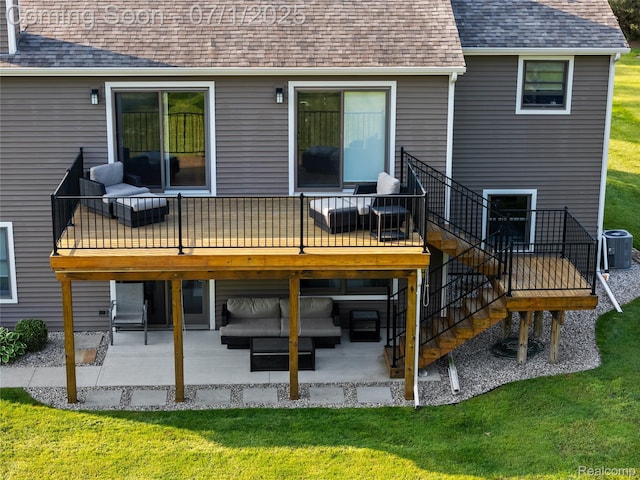 5131 Navajo Trl, Pinckney, MI 48169 - rear view of property featuring an outdoor living space, a patio, roof with shingles, and a deck