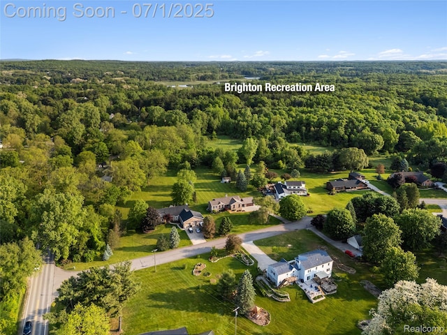 5131 Navajo Trl, Pinckney, MI 48169 - aerial overview of property's location with a heavily wooded area