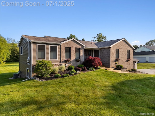 5131 Navajo Trl, Pinckney, MI 48169 - single story home with a front yard, brick siding, and roof with shingles