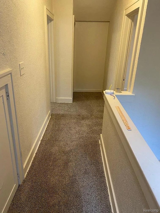 32 S Marshall St, Pontiac, MI 48342 - corridor with a textured wall and carpet flooring