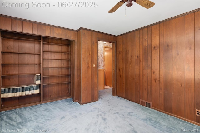 693 Anita Ave, Grosse Pointe Woods, MI 48236 - unfurnished bedroom with wood walls, carpet, crown molding, and ceiling fan