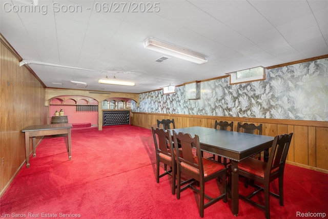 693 Anita Ave, Grosse Pointe Woods, MI 48236 - carpeted dining room with wallpapered walls, wood walls, wainscoting, and ornamental molding