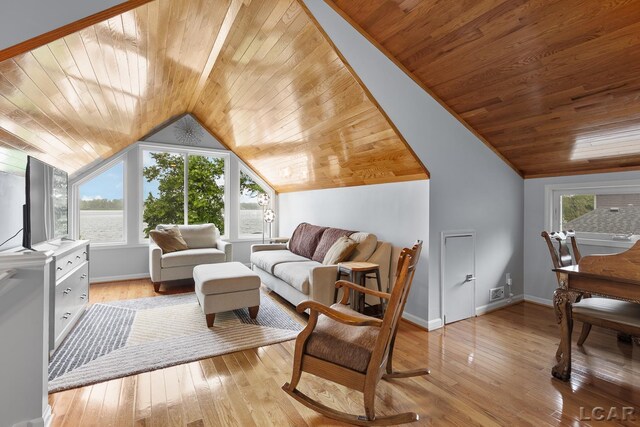 680 Breyman Hwy, Tipton, MI 49287 - living room with wooden ceiling, plenty of natural light, vaulted ceiling, and light wood-style flooring
