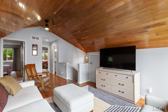 680 Breyman Hwy, Tipton, MI 49287 - living room with vaulted ceiling, a ceiling fan, wood finished floors, and wooden ceiling