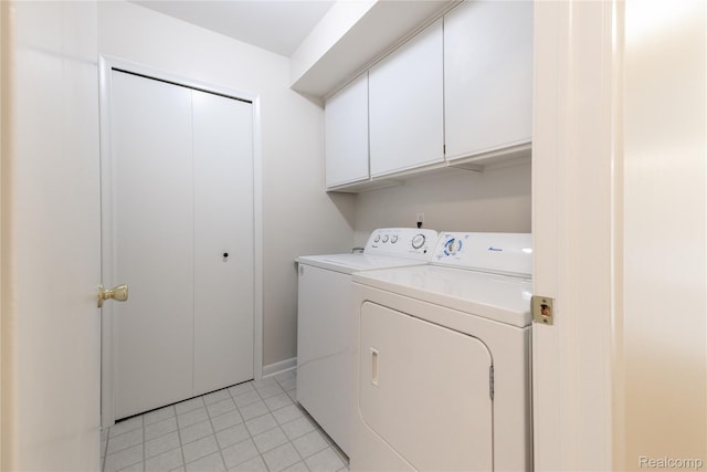 10228 Nancys Blvd Unit 33, Grosse Ile, MI 48138 - washroom featuring cabinet space, independent washer and dryer, and light tile patterned floors