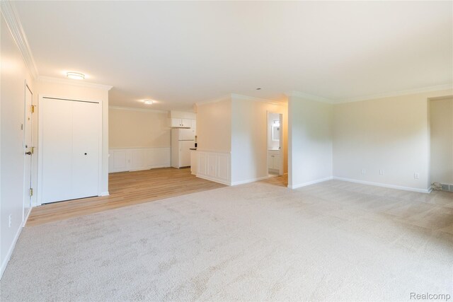 10228 Nancys Blvd Unit 33, Grosse Ile, MI 48138 - unfurnished living room with light colored carpet and ornamental molding