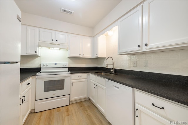 10228 Nancys Blvd Unit 33, Grosse Ile, MI 48138 - kitchen featuring white appliances, under cabinet range hood, white cabinetry, backsplash, and light wood-style floors