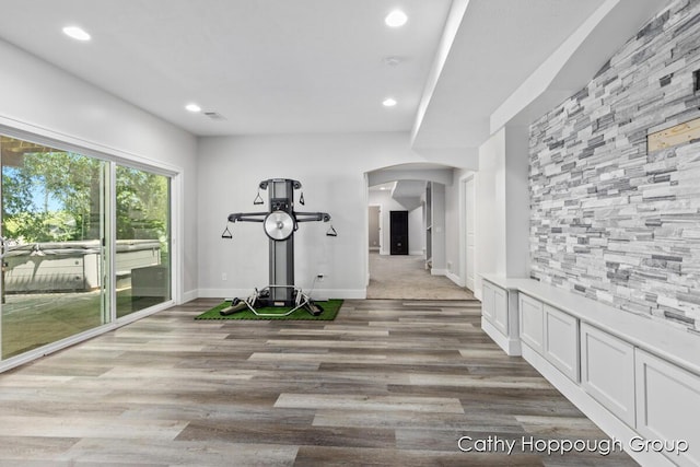 950 Whitetail Ct, Ionia, MI 48846 - workout room with arched walkways, light wood-style flooring, and recessed lighting