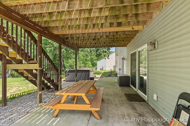 950 Whitetail Ct, Ionia, MI 48846 - view of patio / terrace with a hot tub and stairs
