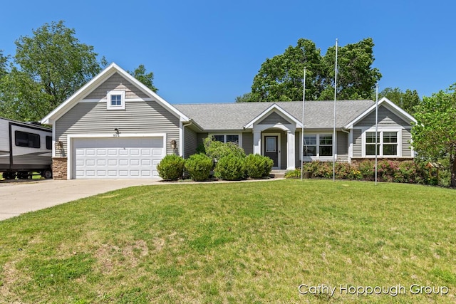 950 Whitetail Ct, Ionia, MI 48846 - single story home featuring an attached garage, concrete driveway, and a front lawn