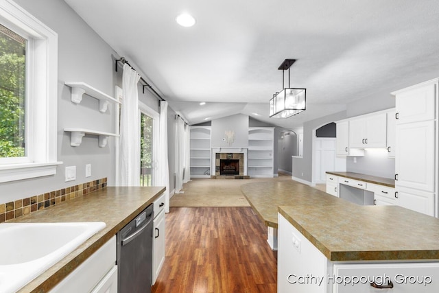 950 Whitetail Ct, Ionia, MI 48846 - kitchen featuring dishwasher, dark wood finished floors, vaulted ceiling, white cabinetry, and recessed lighting