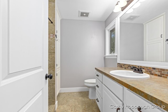 950 Whitetail Ct, Ionia, MI 48846 - full bathroom featuring vanity and tasteful backsplash