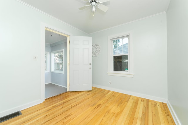 1608 Cambridge Dr, Kalamazoo, MI 49001 - unfurnished room with hardwood / wood-style flooring, ornamental molding, and a ceiling fan