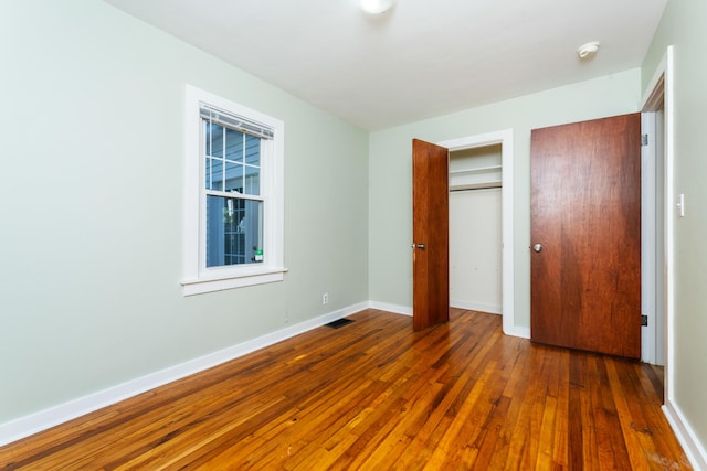 1608 Cambridge Dr, Kalamazoo, MI 49001 - unfurnished bedroom with wood-type flooring and a closet