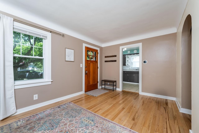 1608 Cambridge Dr, Kalamazoo, MI 49001 - entrance foyer featuring arched walkways and light wood-style floors