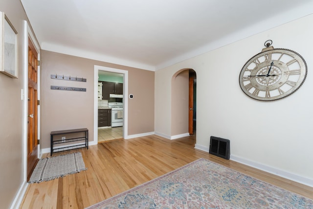 1608 Cambridge Dr, Kalamazoo, MI 49001 - spare room featuring arched walkways and light wood-style flooring