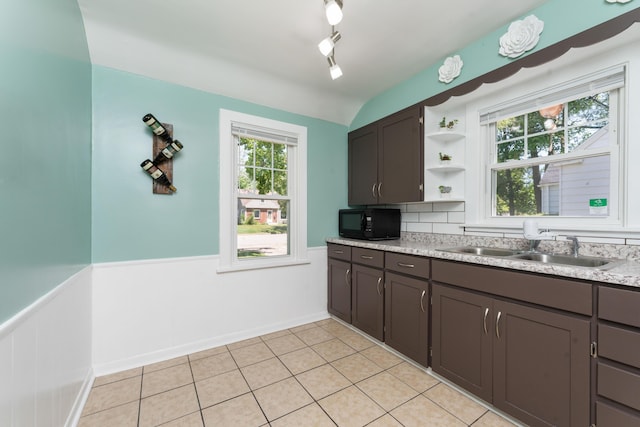 1608 Cambridge Dr, Kalamazoo, MI 49001 - kitchen featuring black microwave, open shelves, a wainscoted wall, light countertops, and dark brown cabinetry