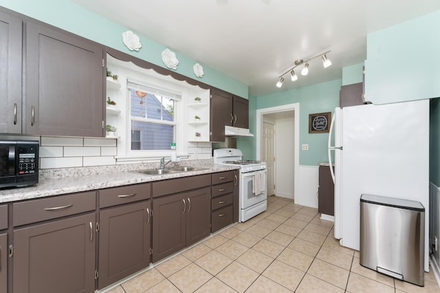 1608 Cambridge Dr, Kalamazoo, MI 49001 - kitchen with white appliances, open shelves, under cabinet range hood, light countertops, and light tile patterned flooring