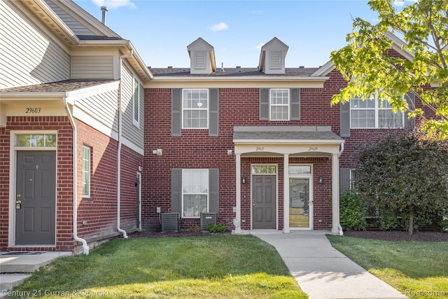 29611 Fox Run Cir, Warren, MI 48092 - view of property with a front yard, brick siding, and roof with shingles