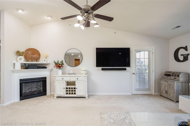 29611 Fox Run Cir, Warren, MI 48092 - living area with vaulted ceiling, light carpet, a ceiling fan, and a fireplace