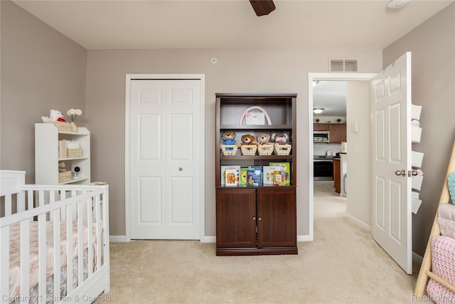 29611 Fox Run Cir, Warren, MI 48092 - bedroom featuring light colored carpet, a closet, and a ceiling fan