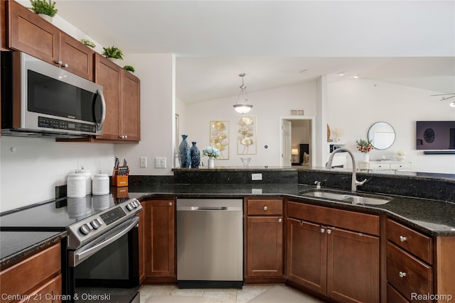 29611 Fox Run Cir, Warren, MI 48092 - kitchen with stainless steel appliances, lofted ceiling, dark stone countertops, and pendant lighting