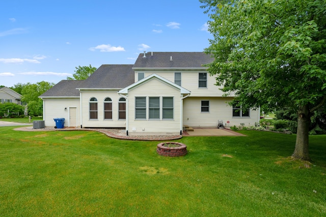 6380 Mcgillicuddy Ln, Portage, MI 49024 - back of property featuring a patio, an outdoor fire pit, and a yard