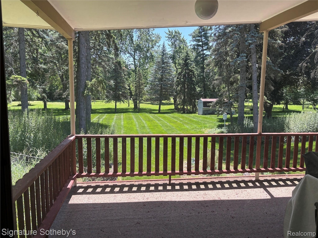 3975 Stonecrest Rd, West Bloomfield, MI 48322 - wooden terrace with a lawn and view of wooded area