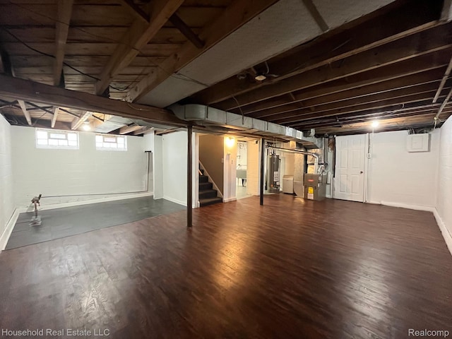 14722 Lydia Ave, Eastpointe, MI 48021 - below grade area featuring stairs, dark wood-type flooring, heating unit, and gas water heater