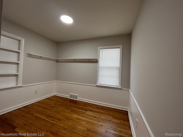 14722 Lydia Ave, Eastpointe, MI 48021 - unfurnished room featuring wood finished floors and built in shelves