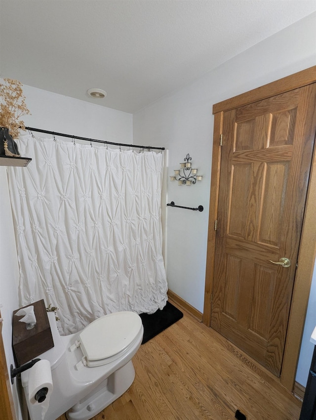2740 Booth Rd, Au Gres, MI 48703 - bathroom featuring wood finished floors and a shower with curtain