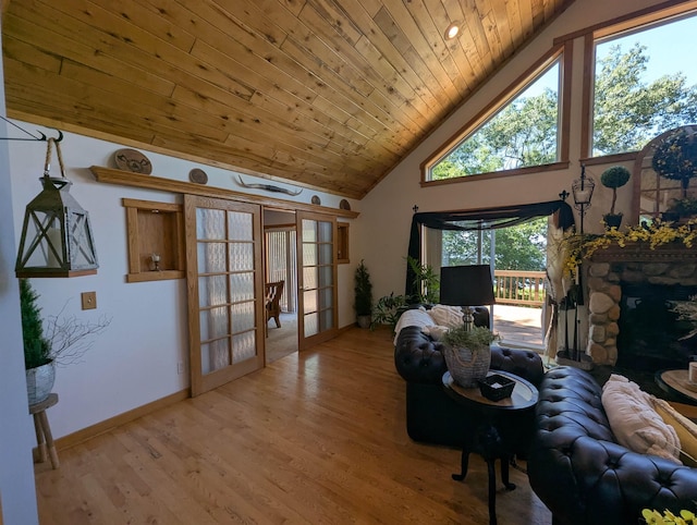 2740 Booth Rd, Au Gres, MI 48703 - living area featuring wood ceiling, high vaulted ceiling, and light wood finished floors