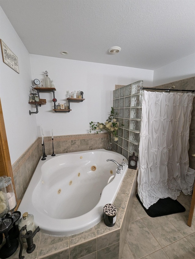 2740 Booth Rd, Au Gres, MI 48703 - bathroom featuring a tub with jets, tiled shower, a textured ceiling, and tile patterned flooring
